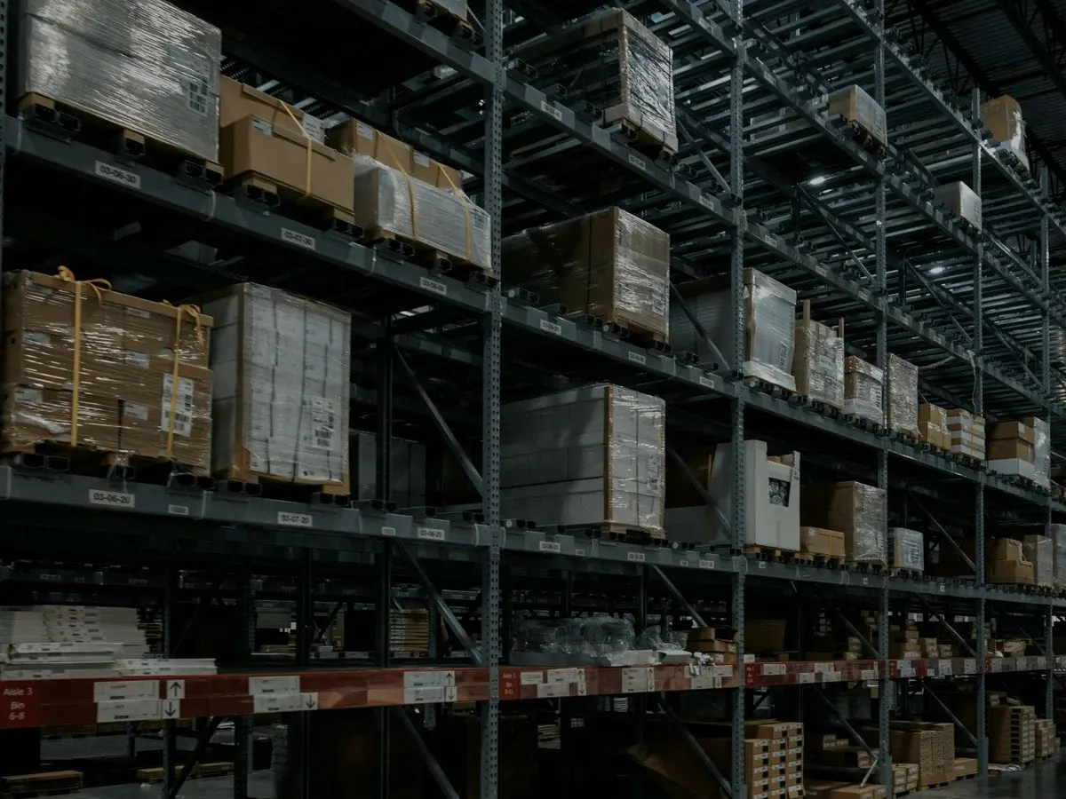 A distributor's warehouse: racks of cases on pallets